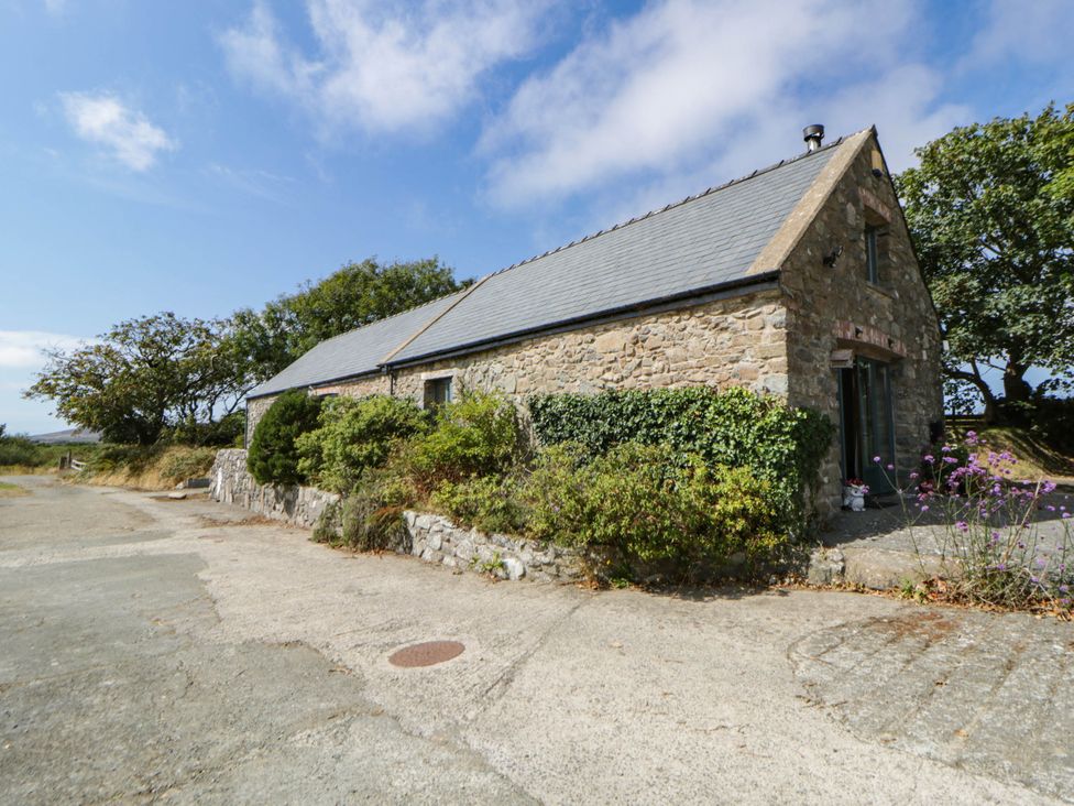 The stone-built exterior of May Cottage with its slate roof