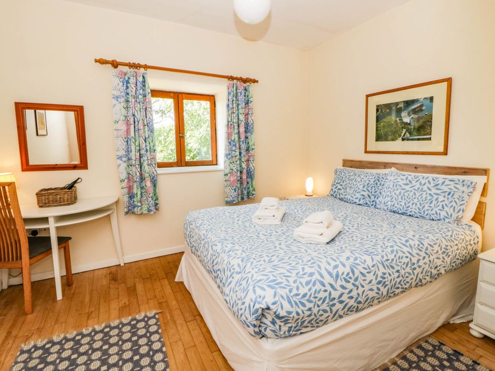 Bedroom with double bed and desk