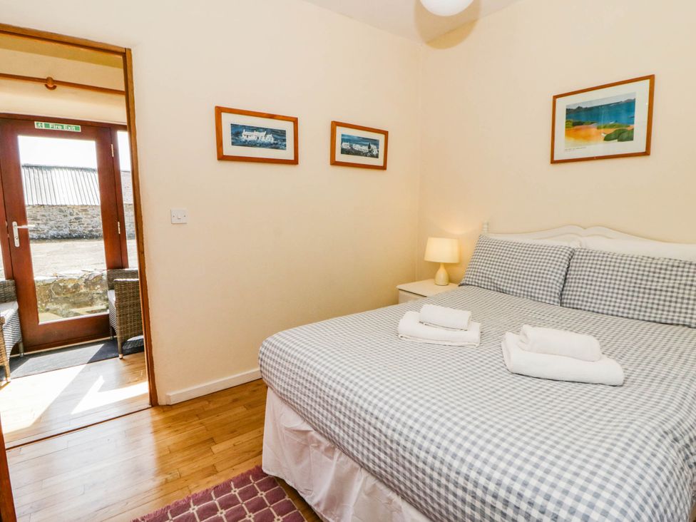 Double bedroom with a door leading outside
