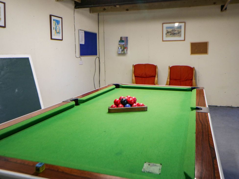 Games room with pool table and chairs