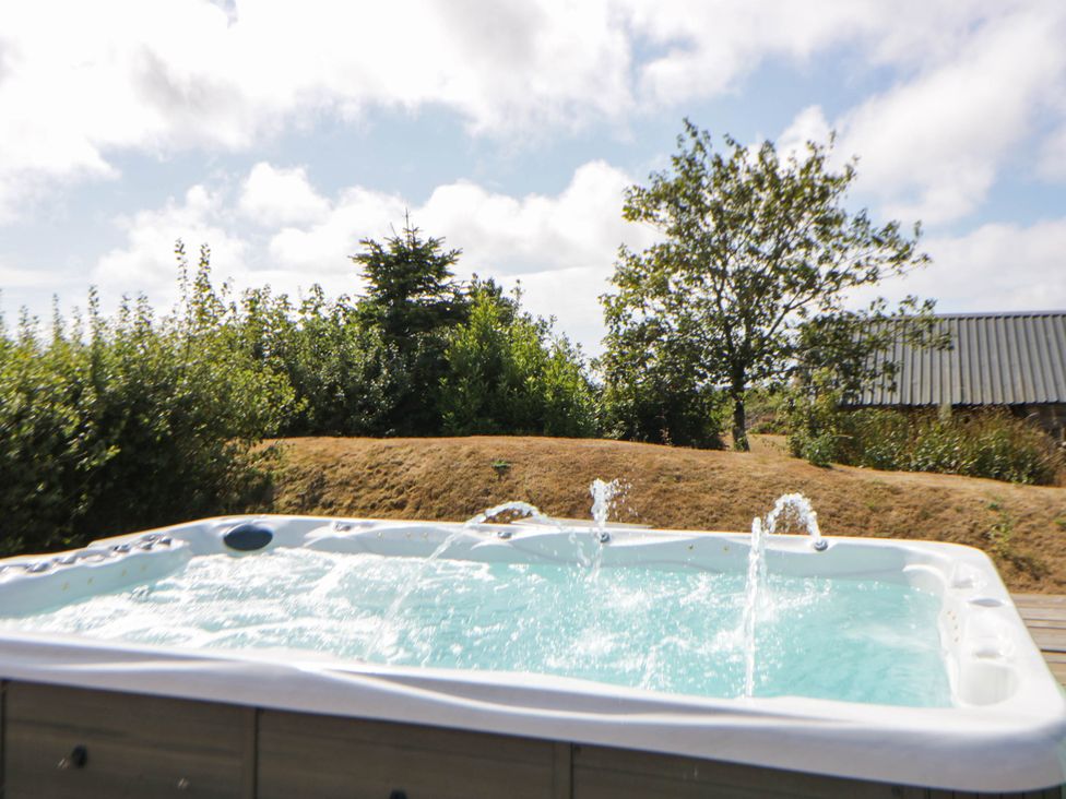 Swim spa surrounded by greenery